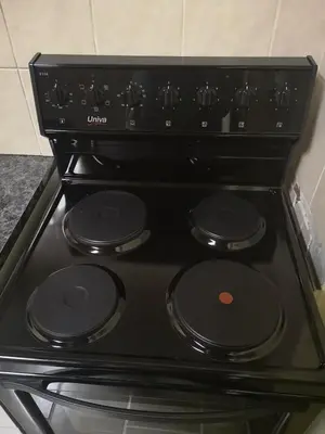 a black stove top with black knobs on it at Transvaal Road, N1 in Worcester