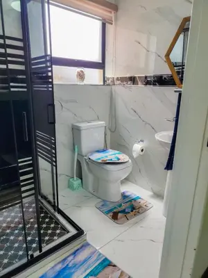 a bathroom with a toilet and a sink at The Seagull in Cape Town