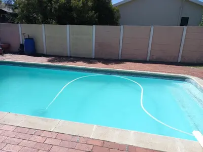 an empty swimming pool with a hose in a yard at Getaway Self-Catering Panorama in Panorama