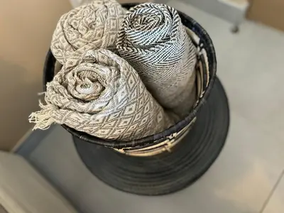 a metal bucket filled with towels sitting on a counter at 111 at The Esplanade in Hermanus