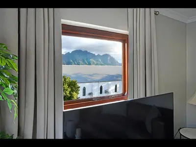 a window in a room with a view of the water at Sorbonne 6 in Franschhoek