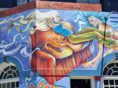 a painting of a mermaid on the side of a building at Obs Centre Luxe Loft in Cape Town