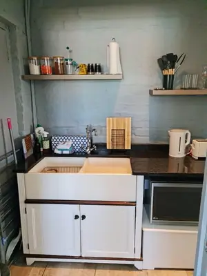 a kitchen with a sink and a counter at H & E Sunset Paradise in Fisherhaven