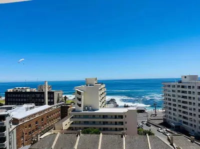 a view of the ocean from a city at Seapoint Solace in Cape Town