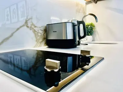 a coffee maker sitting on top of a kitchen counter at Seapoint Solace in Cape Town