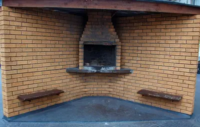 a brick wall with a fireplace in a brick building at Montana Backpackers Cape Town in Cape Town