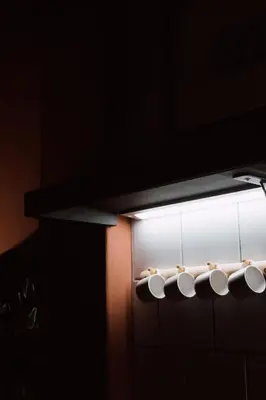 a light hanging from a wall in a bathroom at No 3 at The Barracks in Stellenbosch