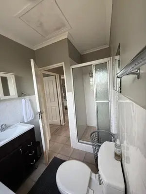 a bathroom with a toilet and a sink and a shower at Boho Bliss in Cape Town