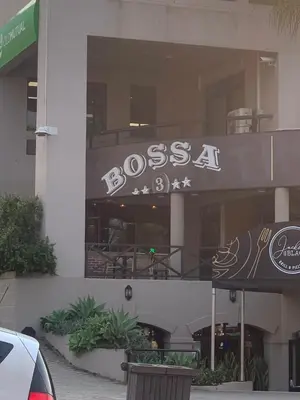a building with a sign that reads bosssa on it at Windpomp Self Catering in Paarl
