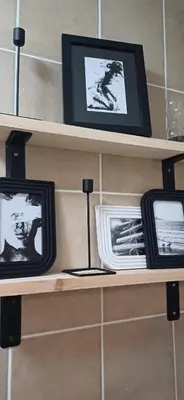 a shelf with three televisions on it at V's Condo in Gordonʼs Bay