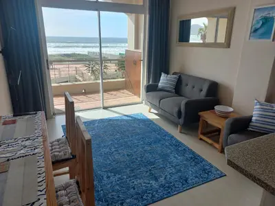 a living room with a view of the ocean at 215 Sea View in Cape Town