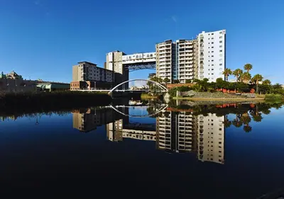 a bridge over a body of water with buildings at Knightsbridge Luxury Escape in Cape Town