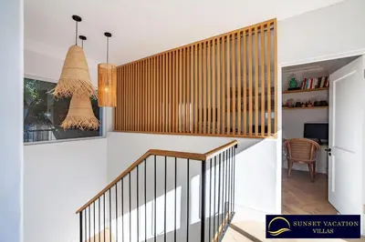 a staircase in a home with white walls at Sunsets Jasmine Villa in Cape Town