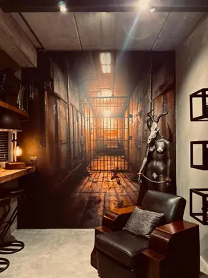 a room with a wall painting of a hallway at Tether and Tease, The Citadel in Cape Town
