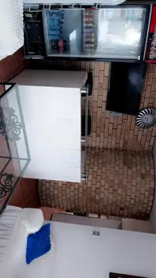 a kitchen with a counter top and a microwave at Hussein accommodation in Cape Town