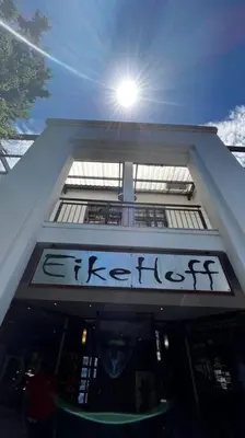 a building with a sign on the front of it at Cosy Central Apartment - By ARPA Hospitalities in Stellenbosch