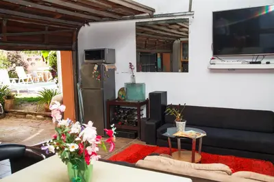 a living room with a couch and a table at Luxurious Flatlet in the heart of Mowbray in Cape Town