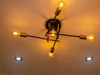 a chandelier hanging from a ceiling with lights at Comfort on Wrench in Cape Town