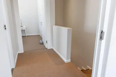 a hallway with a white door in a room at 2D on Nansen in Cape Town