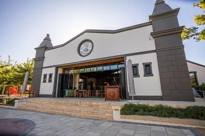 a building with a clock on the front of it at Franschhoek Hotel in Franschhoek