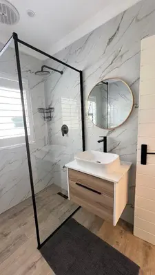 a white bathroom with a sink and a mirror at Luxurious 12 sleeper Appaloosa Villa in Cape Town