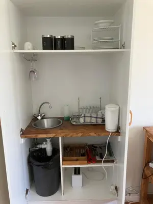 a kitchen with a sink and a counter top at Table View Lodge in Cape Town