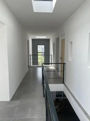 a hallway with a staircase in a building at Villa Sur La Mer in Pringle Bay