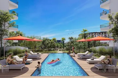 a group of people sitting around a swimming pool at ParkPlace in Cape Town