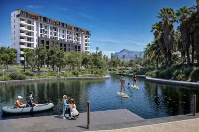 a group of people on paddle boards in a river at ParkPlace in Cape Town