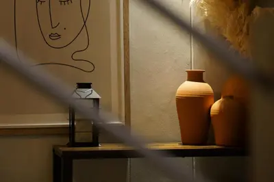 three vases sitting on a shelf in a room at Tyger Lake Luxury Loft in Cape Town