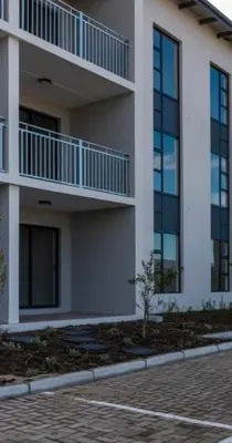 a building with balconies on the side of it at Sunny Escapes Rentals in Cape Town