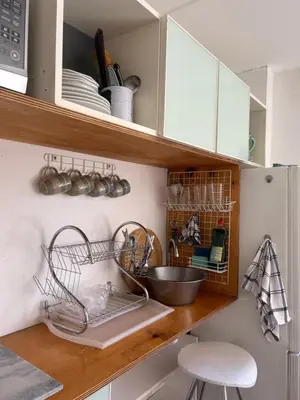 a kitchen with a counter with baskets and a sink at Serene Studio in Cape Town