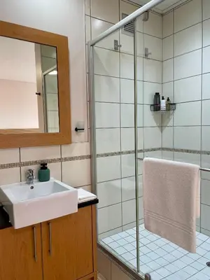 a bathroom with a sink and a shower at Studio in the City in Cape Town