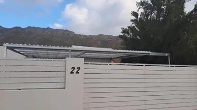 a white garage with the number on it at Annebella's in Gordonʼs Bay