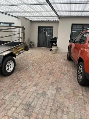 an empty garage with a car parked in it at Annebella's in Gordonʼs Bay
