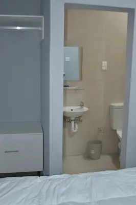 a bathroom with a sink and a toilet at The Gem Guest House & Spa in Parow