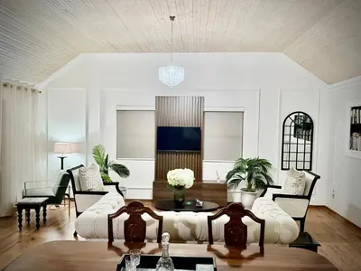 a living room with a couch and a table at Vendôme in Somerset West