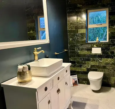 a bathroom with a sink and a toilet at Vendôme in Somerset West