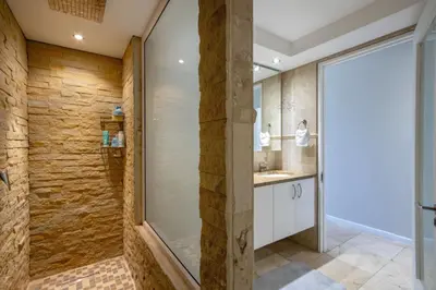 a bathroom with a shower and a sink at Atlantica202 in Strand