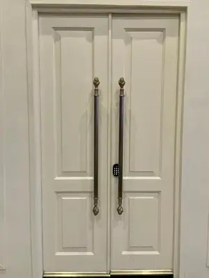 a pair of white doors with a pole at Whale Coast Luxury in Bettyʼs Bay