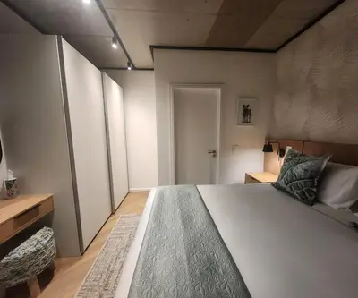 a bedroom with a large white bed in a room at 308 Bridgewater One - Two Bedroom Apartment with Park Views in Cape Town