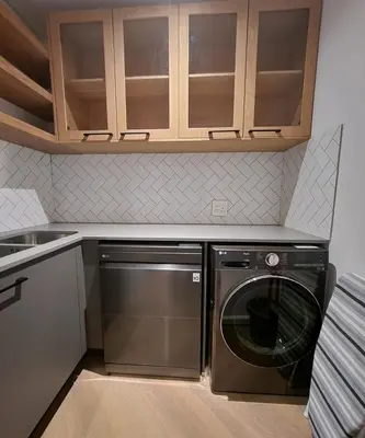 a kitchen with a stainless steel dishwasher and cabinets at 308 Bridgewater One - Two Bedroom Apartment with Park Views in Cape Town