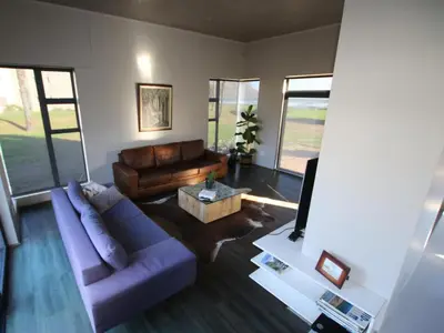 a living room with a couch and a table at Misty Mountain in Strand