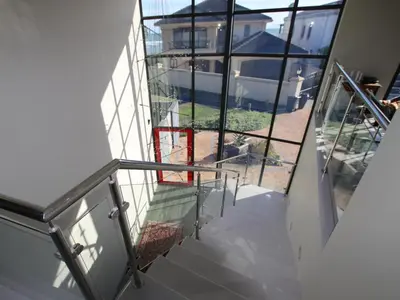 a stairway with a view of a house at Misty Mountain in Strand