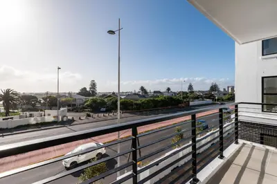a balcony with a view of a street at Burmeister 302 - Beach Front Views with Onsite Parking in Cape Town