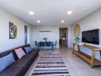 a living room with a couch and a table at Budapest Boutique Hotel in Edgemead