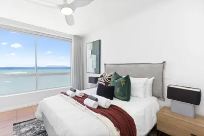 a bedroom with a large bed with a large window at Odeon Towers 1007 by Host Agents in Cape Town