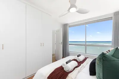 a bedroom with a bed with a view of the ocean at Odeon Towers 1007 by Host Agents in Cape Town