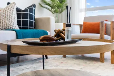 a coffee table with a plate of food on it at Odeon Towers 1007 by Host Agents in Cape Town