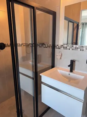 a bathroom with a sink and a shower and a tub at Protea house in Cape Town